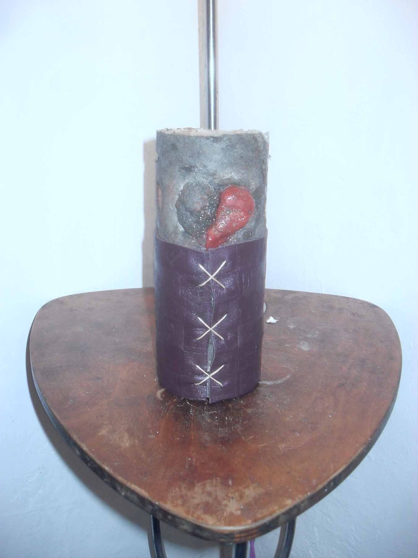 Heart Assistant, 2022, concrete, clay, cow leather, 17,6 × 7,5 × 7,5 cm