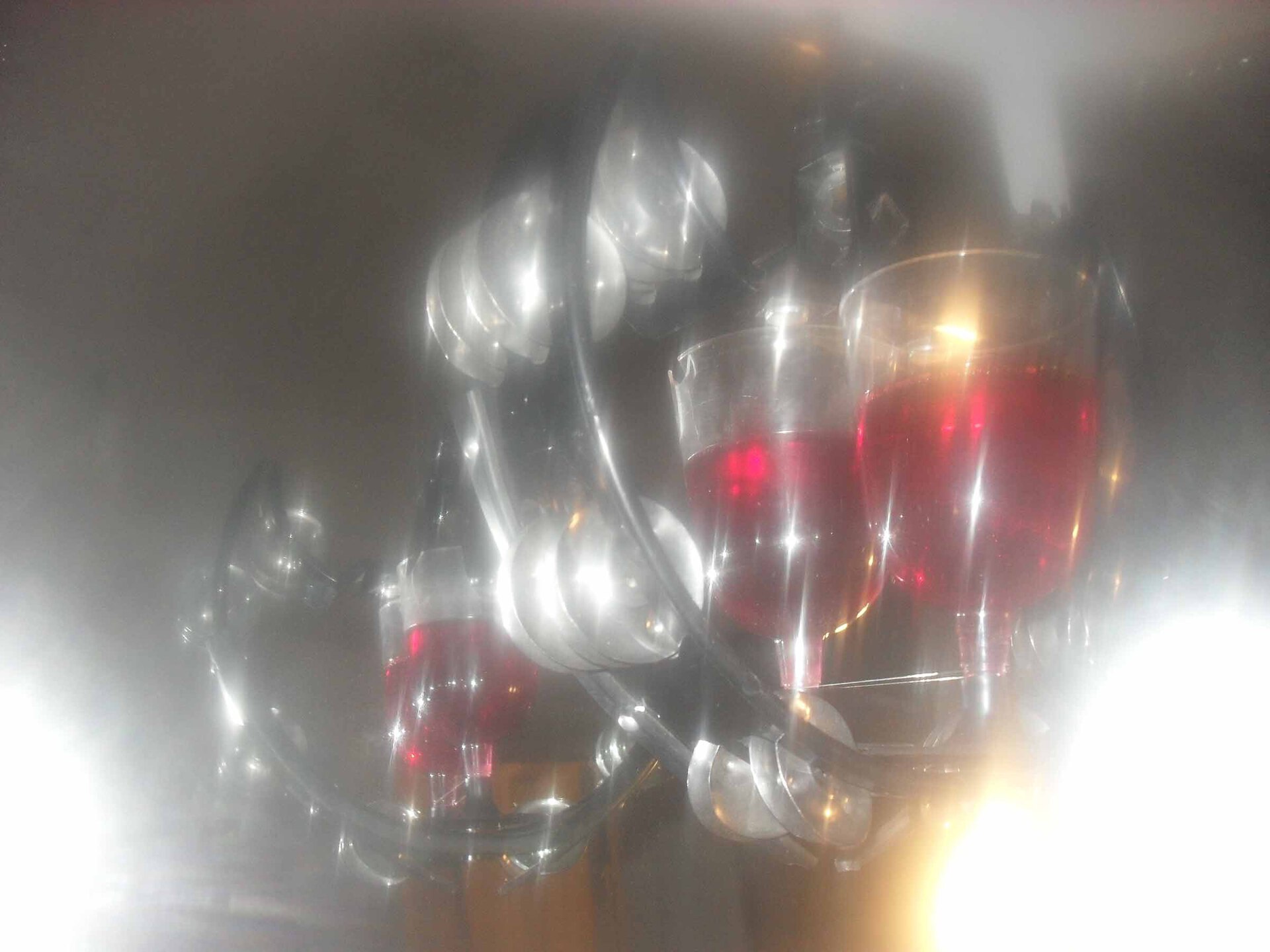 Drink for Two, 2022, tambourine, plastic glasses, epoxy resin, 26 × 21,5 × 16 cm