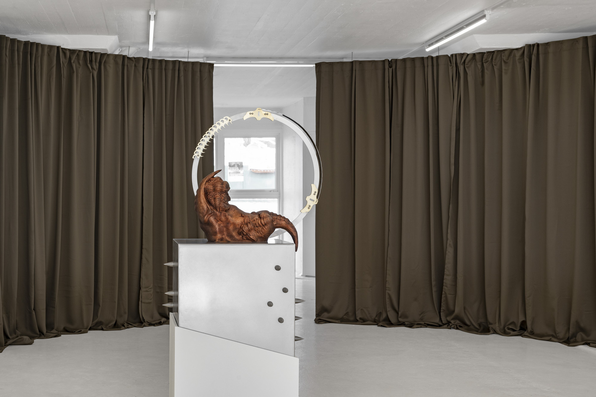Inside Job, “Voracity Loop”, 2022, mahogany wood, stainless steel, brass , 40 x 45 x 178cm