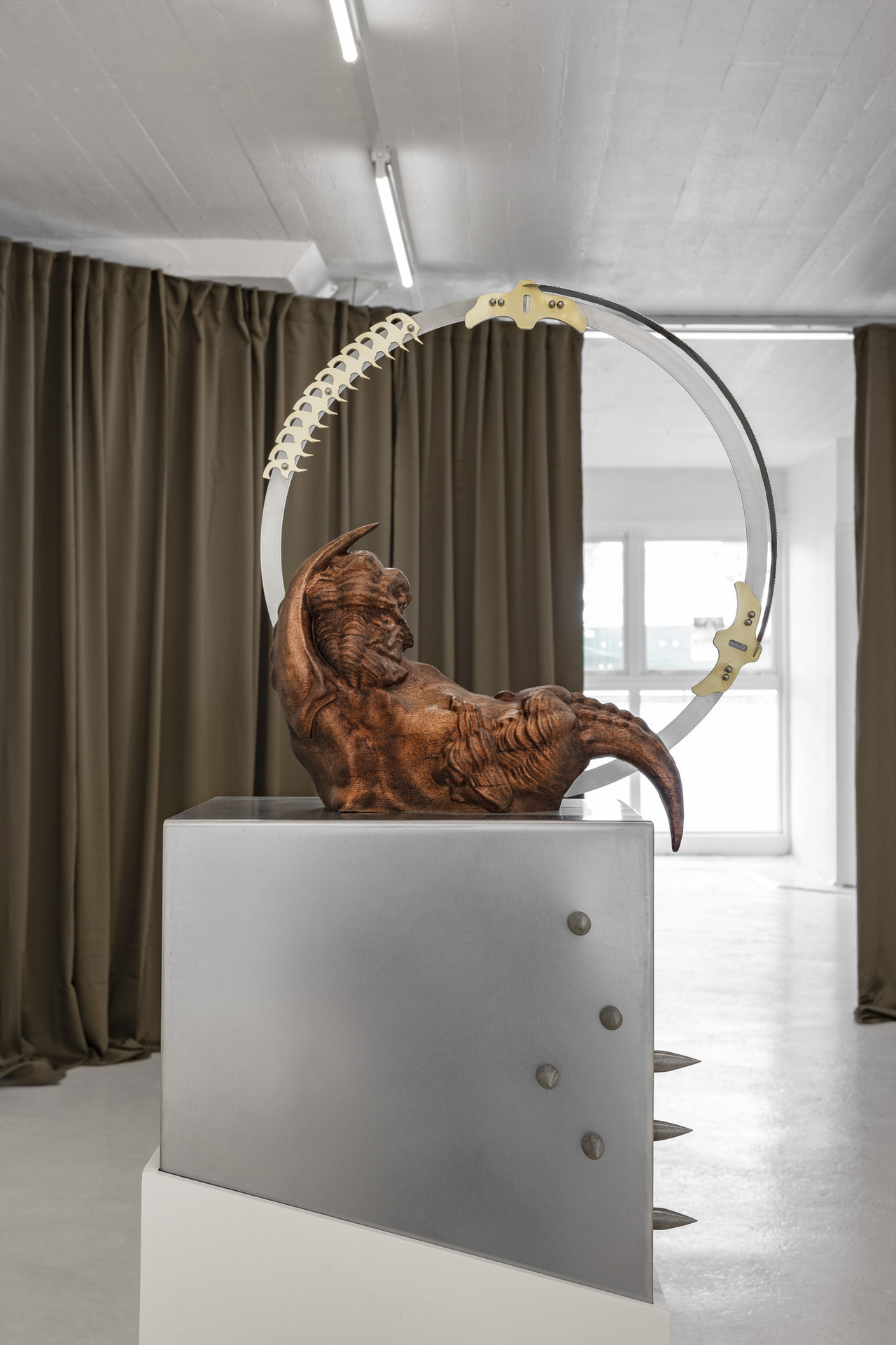 Inside Job, “Voracity Loop”, 2022, mahogany wood, stainless steel, brass , 40 x 45 x 178cm