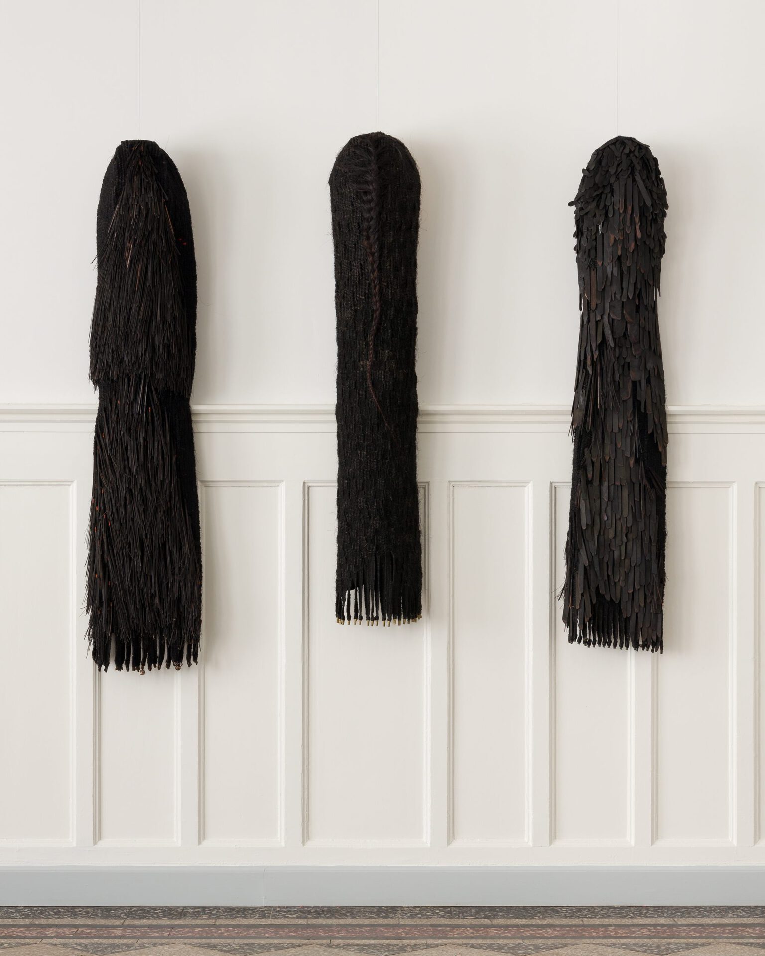 Annette Holdensen, witches coats, 1983, tar, sisal, piassava broom, copper wire, metal, bamboo, crepe de chine, ribbons, cotton, beech sticks, silk taffeta, iron and bamboo, 3 x 186 x 56 cm