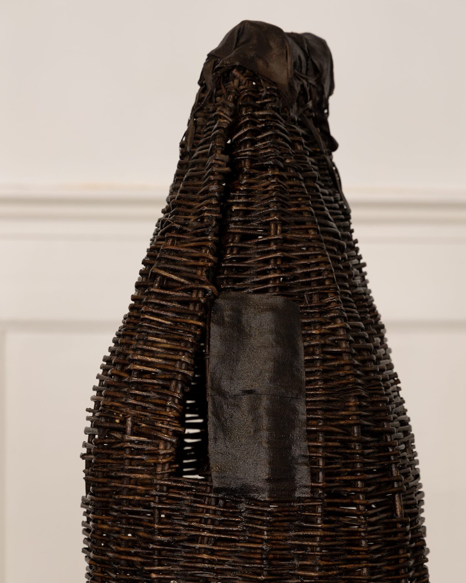 Annette Holdensen, witches coats, 1983, tar, sisal, piassava broom, copper wire, metal, bamboo, crepe de chine, ribbons, cotton, beech sticks, silk taffeta, iron and bamboo, 3 x 186 x 56 cm