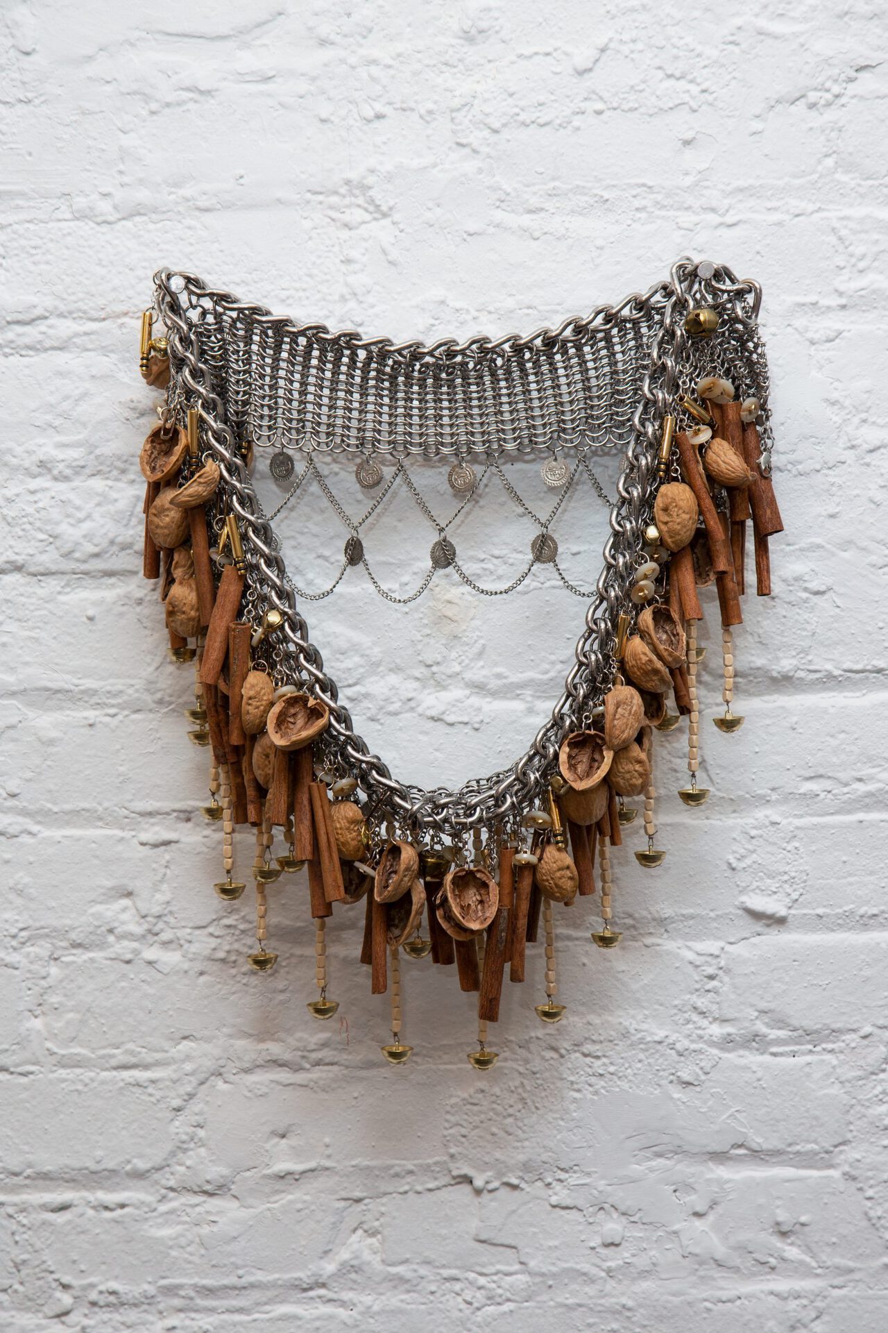 Aminah Ibrahim, منجور (manjur), 2022, Stainless steel maille, bamboo beads, brass buttons, steel chain, cinnamon sticks, walnut shells, etc