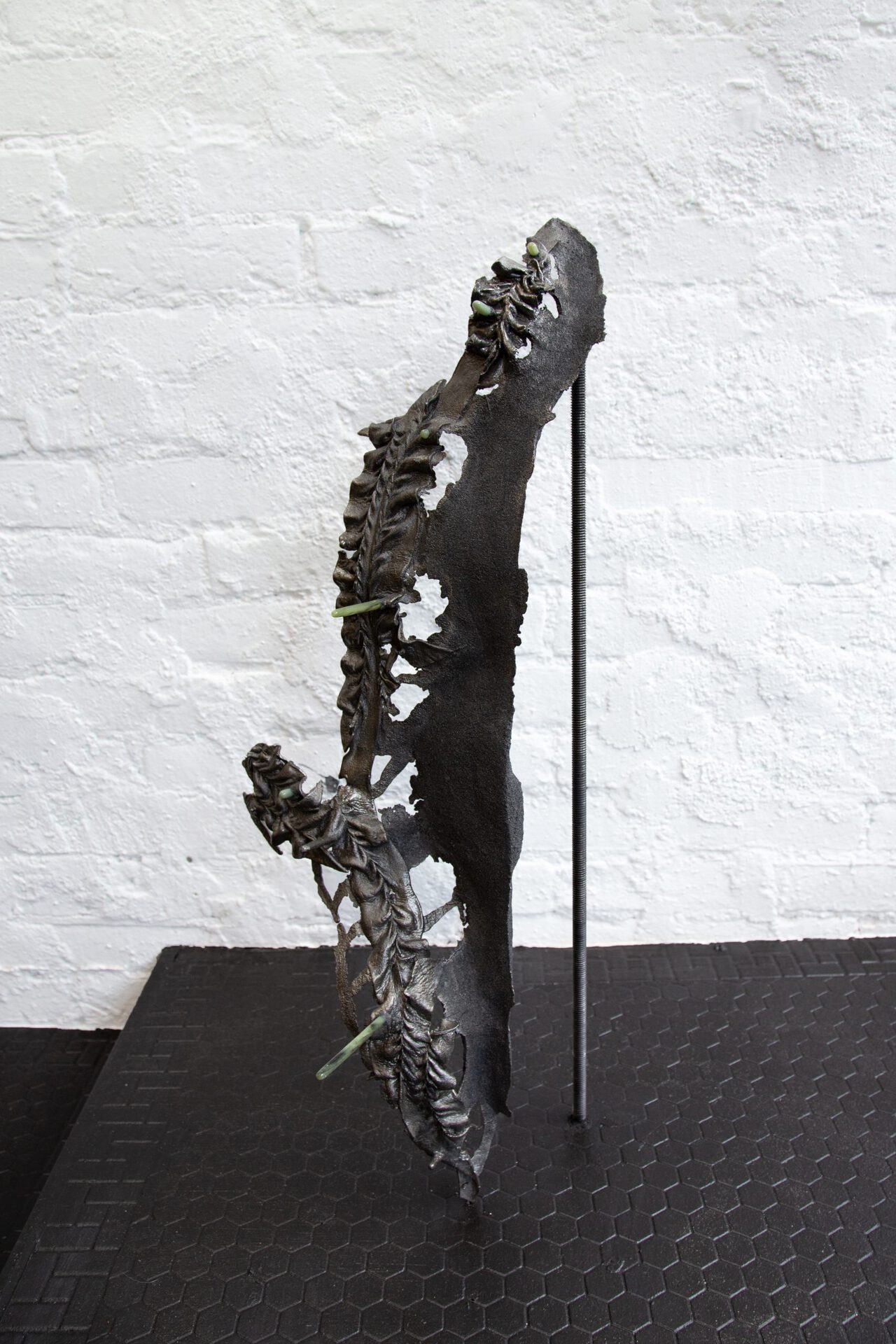 Alice Gong Xiaowen, "…where the echo is able to give, in its own language, the reverberation of the work in the alien one." (stilt, low), 2019-2022, Cast iron, soapstone, stainless steel, 38 x 18 x 100 Inches