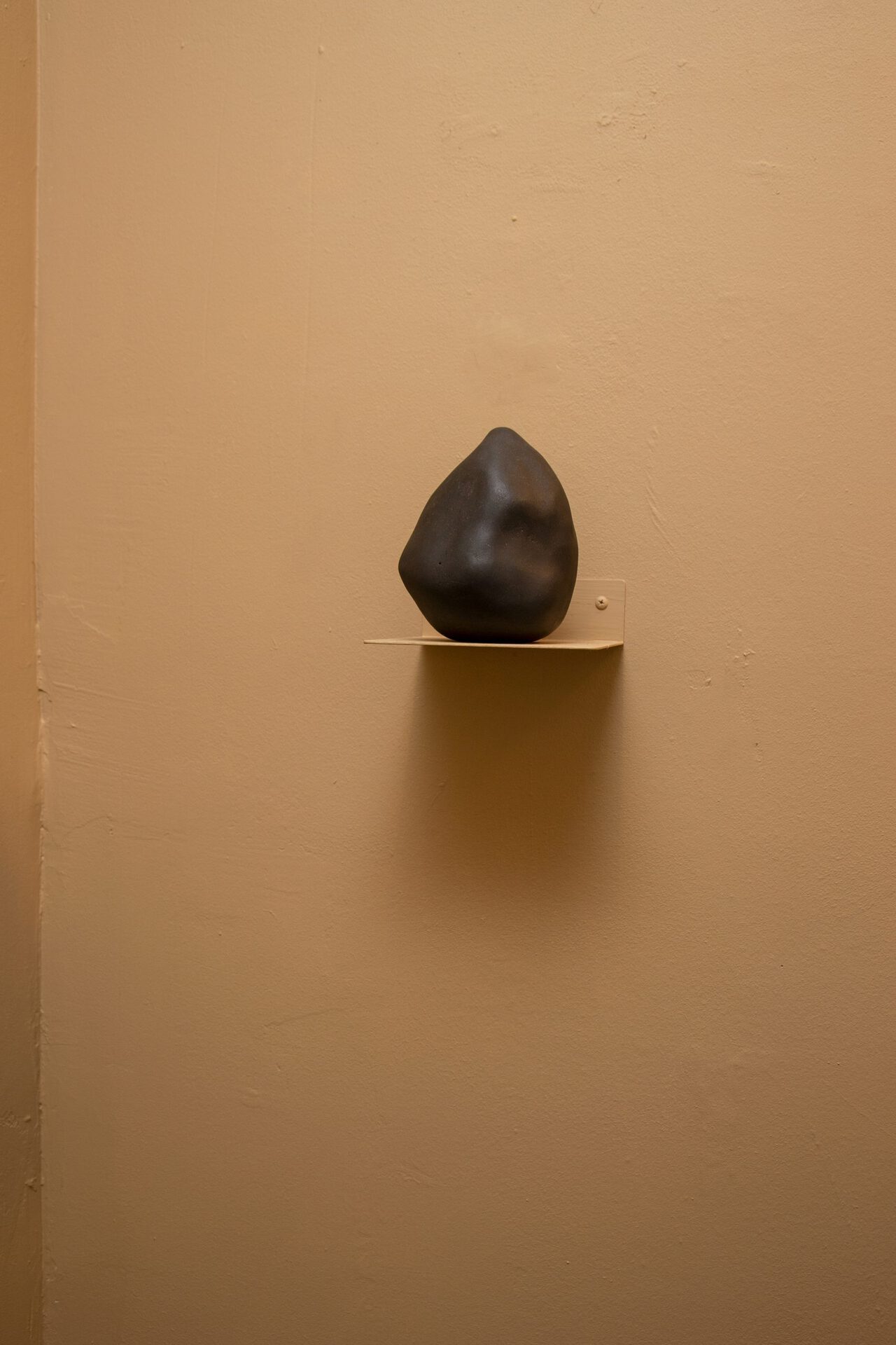 Nissa Nishikawa, Shintai 12, 2022, burnished onyx clay, 7 x 15.5 x 5 Inches