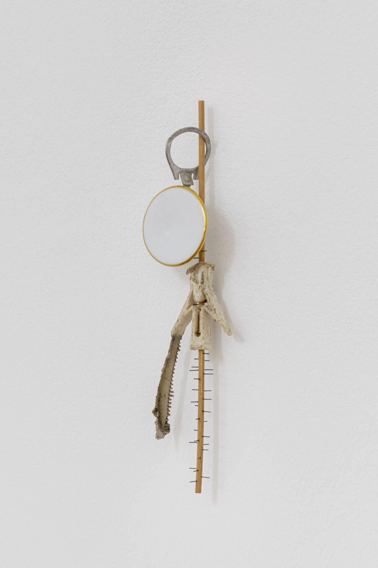 David Fesl, Untitled, 2022, plastic, plastic comb, oak skewer, porcelain teapot knob, tin lid, mechanical pencil refill, 18 × 4.2 × 1.9 cm