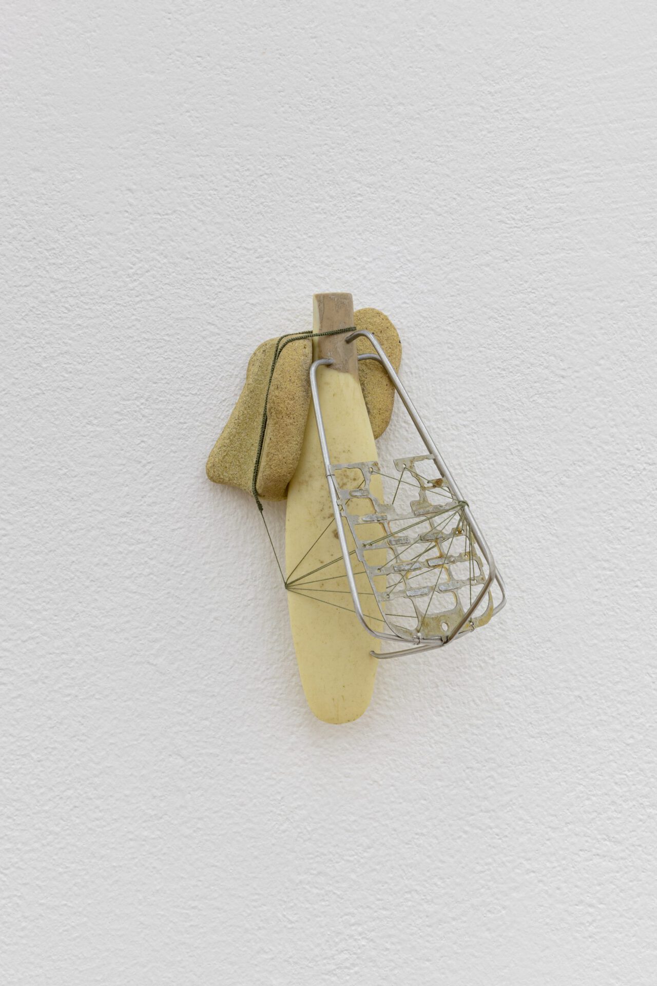 David Fesl, Untitled, 2022, sea mineral, kitchen utensil handle, blender whisk, mobile phone keyboard, silk thread,10.9 × 7.2 × 5.3 cm