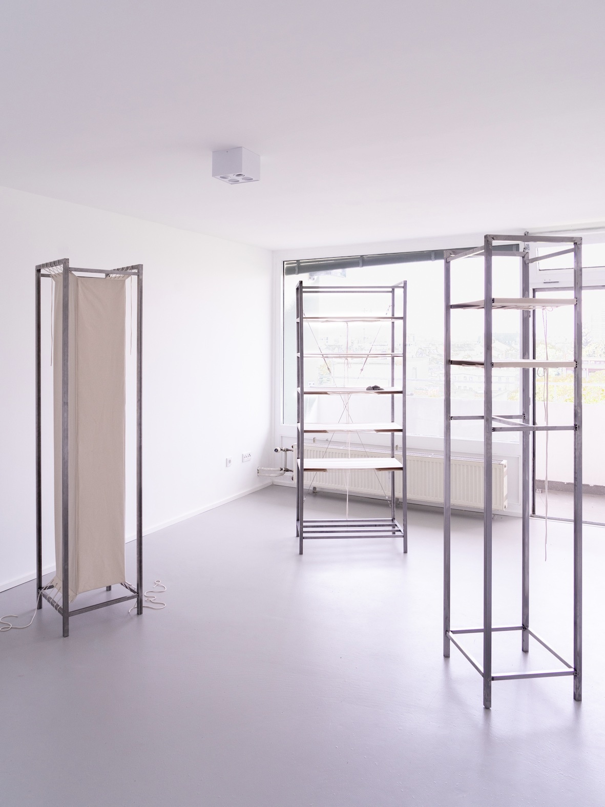 Luzi Gehrisch, stenz und charlie, installation view 2, 2022, teel square tubes, cotton, 45 x 45 x 198 cm, 45 x 45 x 198 cm, 78 x 45 x 198 cm