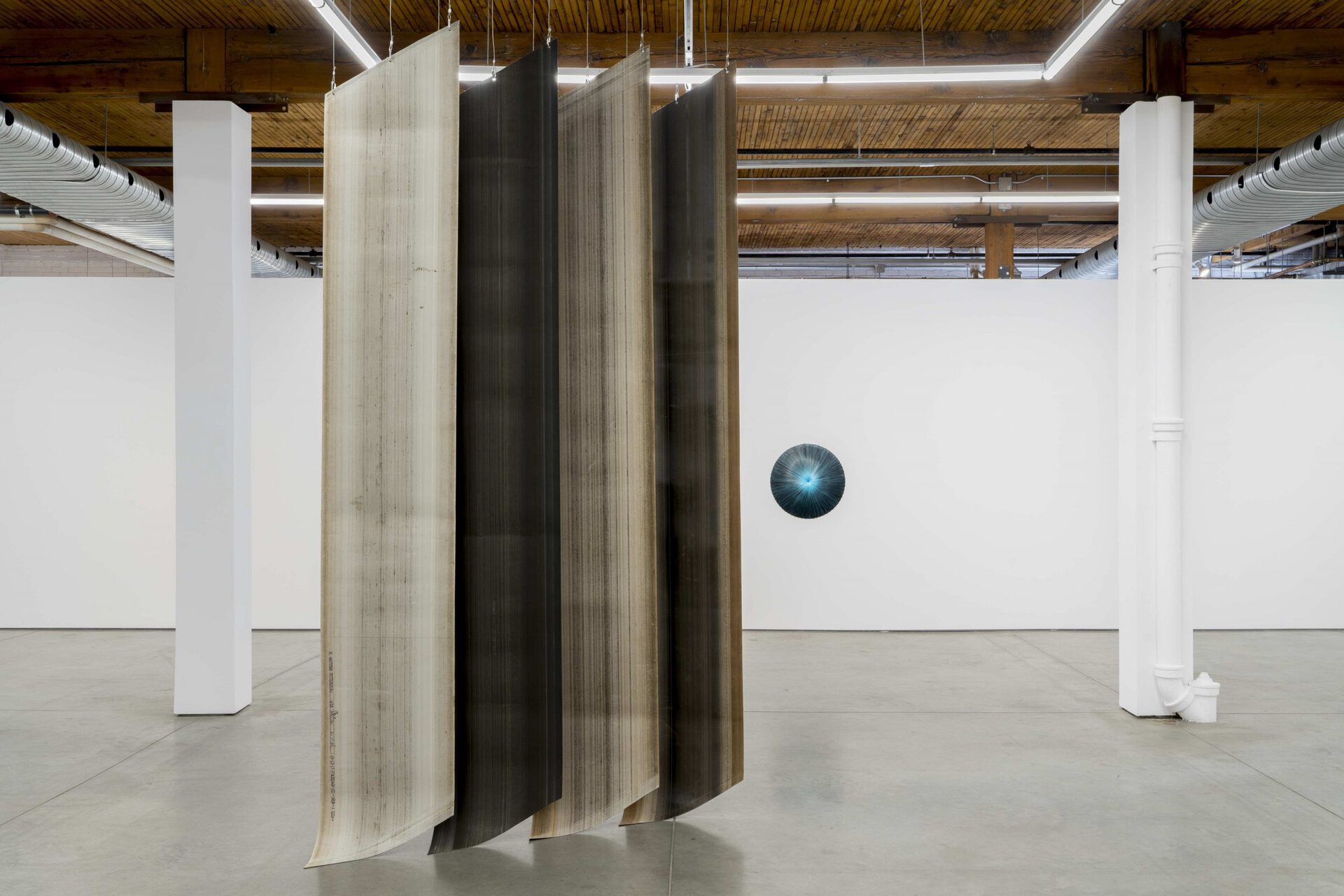 Gabriele Beveridge & Carlos Reyes, Laps, 2022. Exhibition view with Untitled (2022) and Orbit IV (2022), Bradley Ertaskiran, Montreal, Canada.