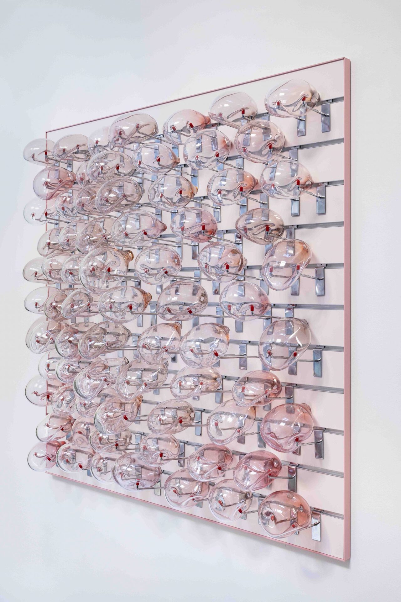 Gabriele Beveridge Lattice, 2022, Hand-blown glass, slatwall hooks, powder-coated slatwall and frame, 120 x 120 x 30 cm. (47¼ x 47¼ x 11¾ in.)