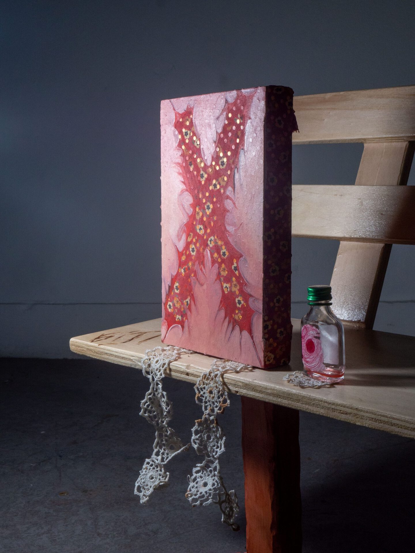 Hatice Pinarbasi - 2022 - Oil on clothes, glitter, lace, alcool bottle, wood, bracelet - 50x100cm