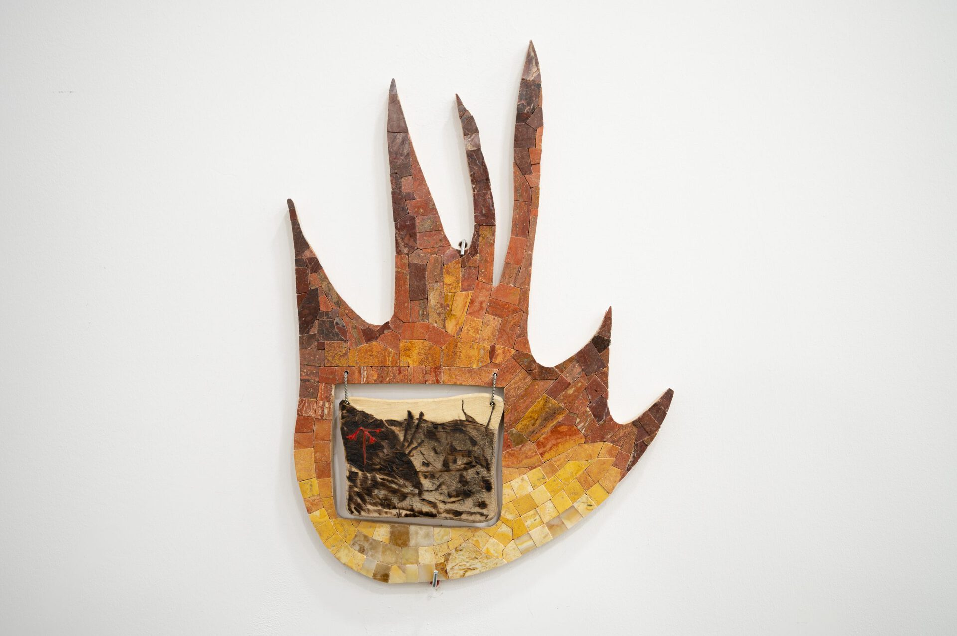 Gvantsa Jishkariani, RISING FROM THE ASHES AFTER FIRES,2022 Marble, Travertine, Onyx mosaic, silver chain, Pastel and pencils on burnt wood plate 35 x 48 x 1,5 cm