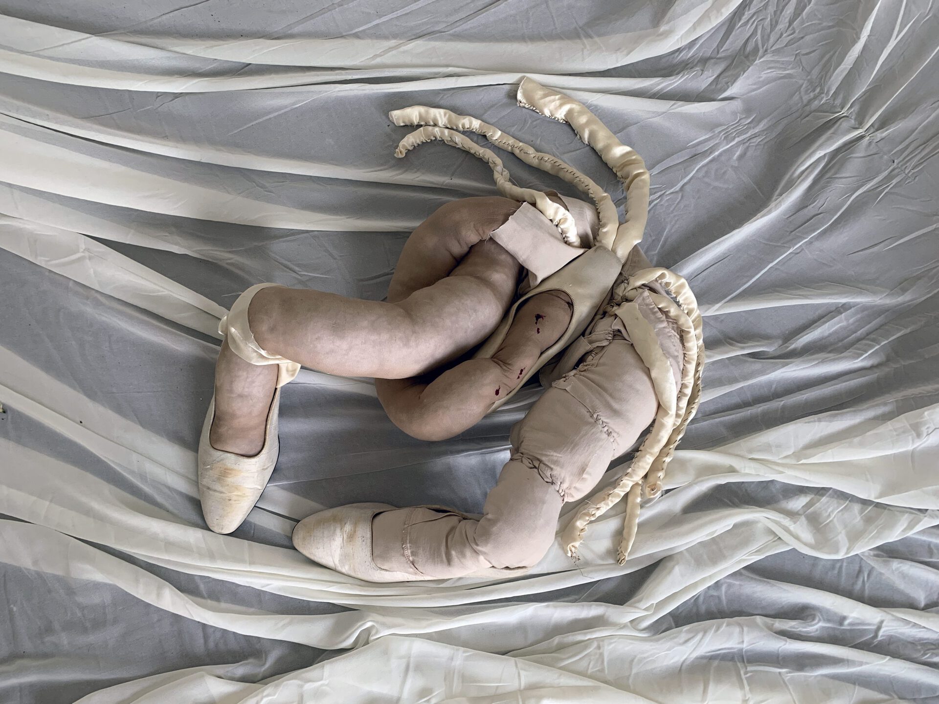 Lola, Untitled, 2022, nylon and artificial cotton, fabric, shoes