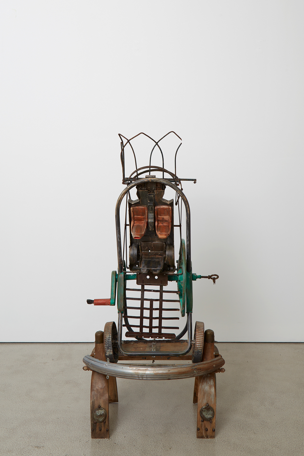 Isabella Costabile, Spider Gentrification, 2021 Mixed media on wooden camel saddle, plastic hose trolley, bicycle mudguard, iron grill, keys, plastic toy, iron tools, 128 x 60 x 60 cm