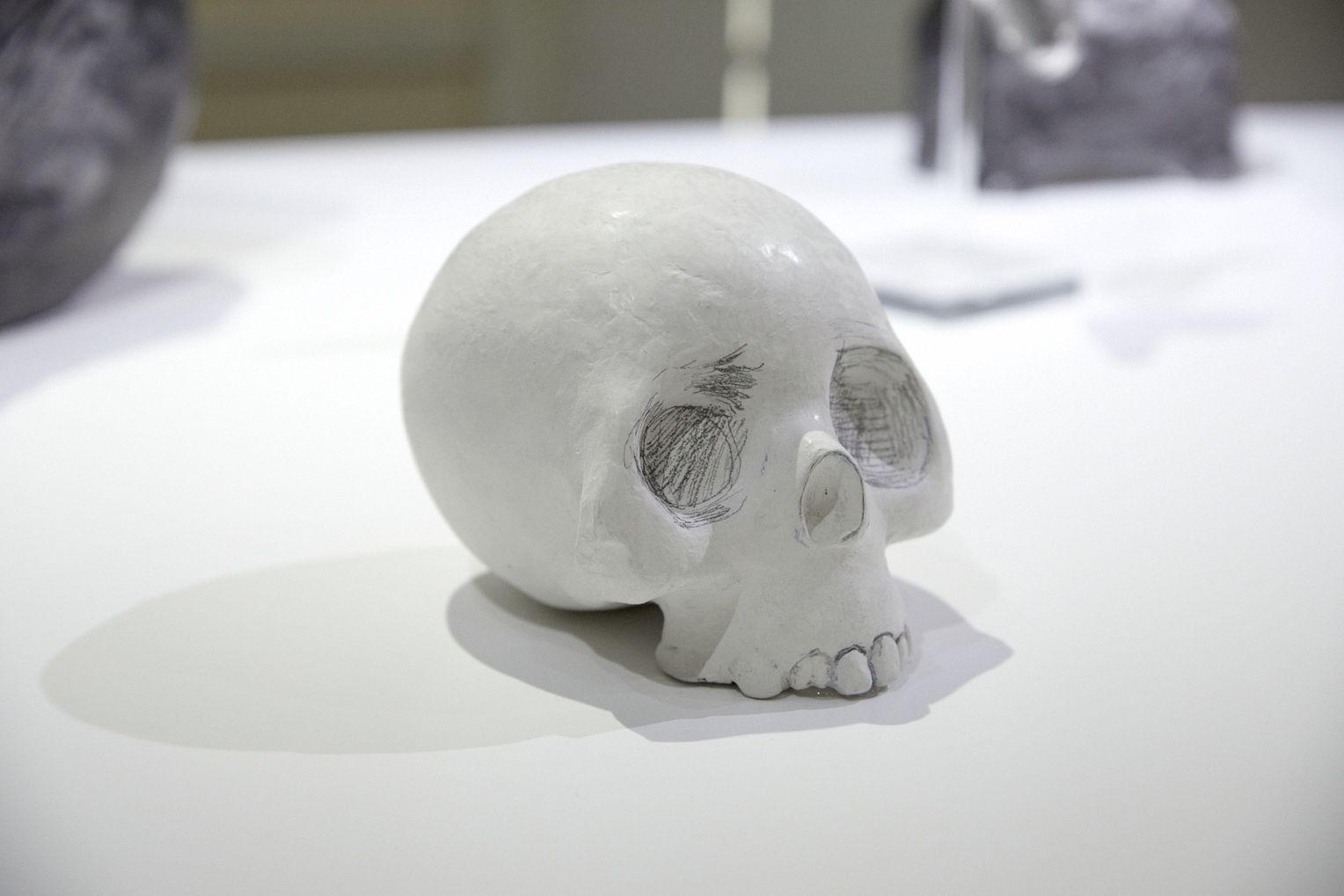 Marianne Walker, Vanitas, 2022, pencil on sculpted paperclay, 17 x 14 x 14cm