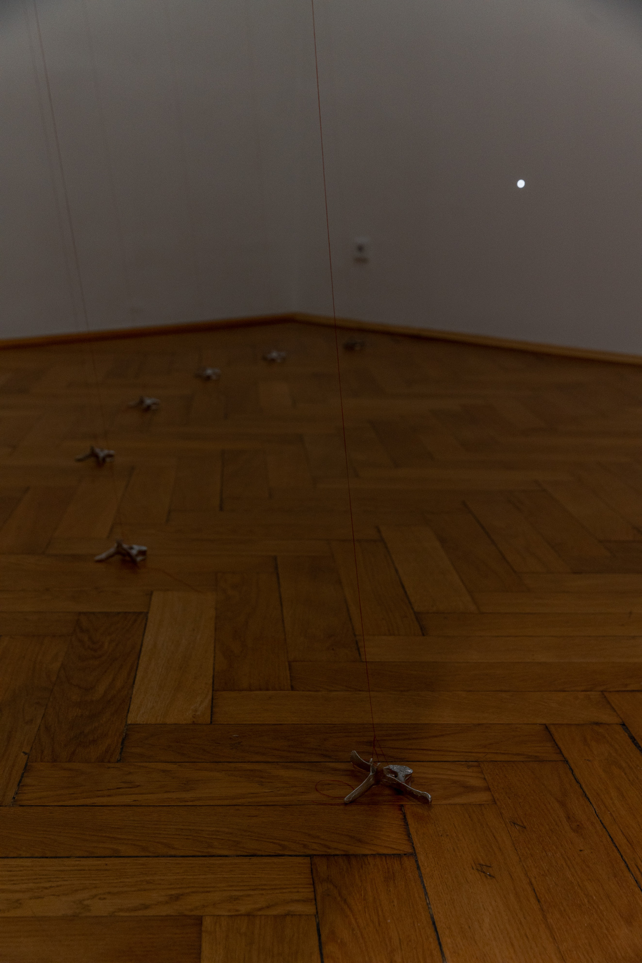 Yen Chun Lin, "We don’t know where they are bringing us to, whom we will fall into", 2022, time-specific installation: dreams, sunlight between 3-5pm, sound, hole, water, red thread, tape, pewter