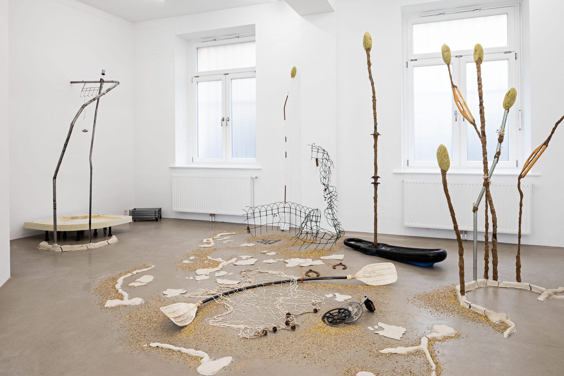 Metal, clay, cultiwool, table leg, wire, incense-holder, plastic, chainring, sealant, aquarium-sand, bassin, candlewick, thread, synthetic grapes, bike chain, acrylic, pipe, rope, granules, chair, gold glitter, paddle, fish net, pedal, fence, metal triangles Dimensions variable (Detail II)