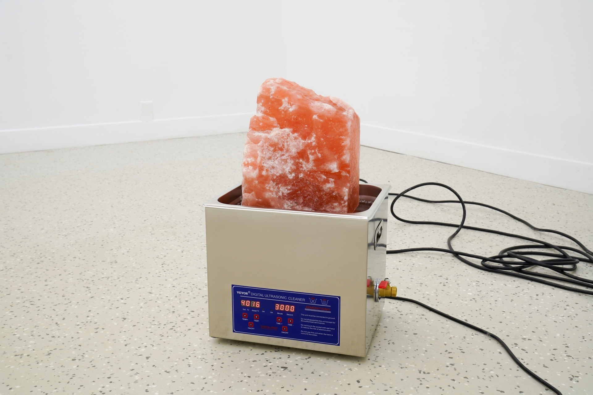 Graham Wiebe, Study for a Water Burial, 2022, ultrasonic cleaner, water, salt rock, extension cord, 20x12.5x10.5 in