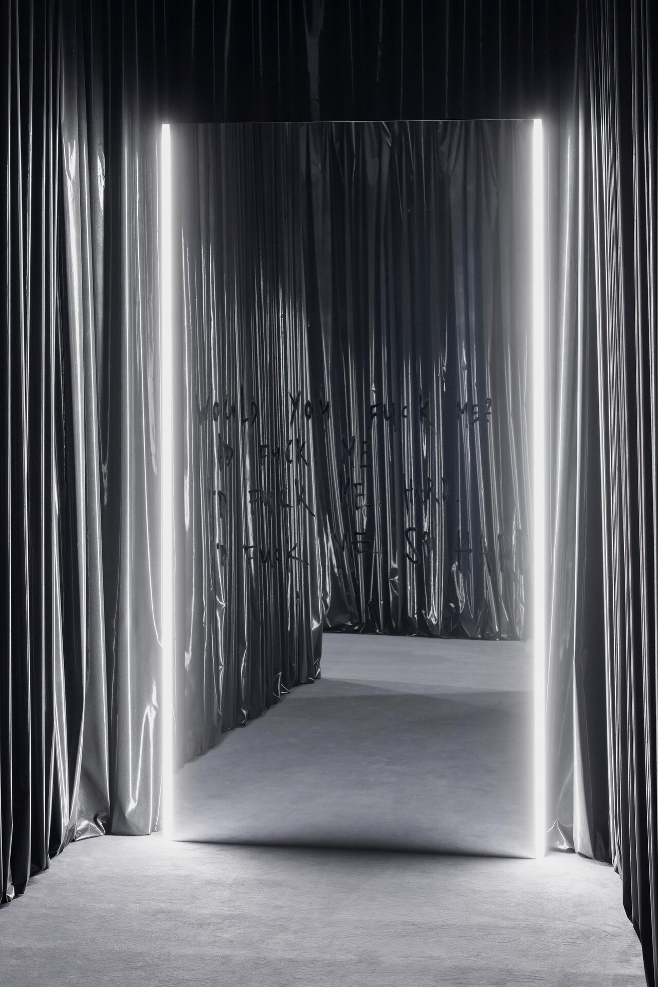 Julian-Jakob Kneer, WOULD YOU FUCK ME? I'D FUCK ME I'D FUCK ME HARD. I'D FUCK ME SO HARD. (BUFFALO BILL), 2022, Mirror foil on alu-frame, lipstick, LED lights, metal lacquer on vinyl curtain, mirror: 298 x 156 x 4 cm; curtain: variable dimensions