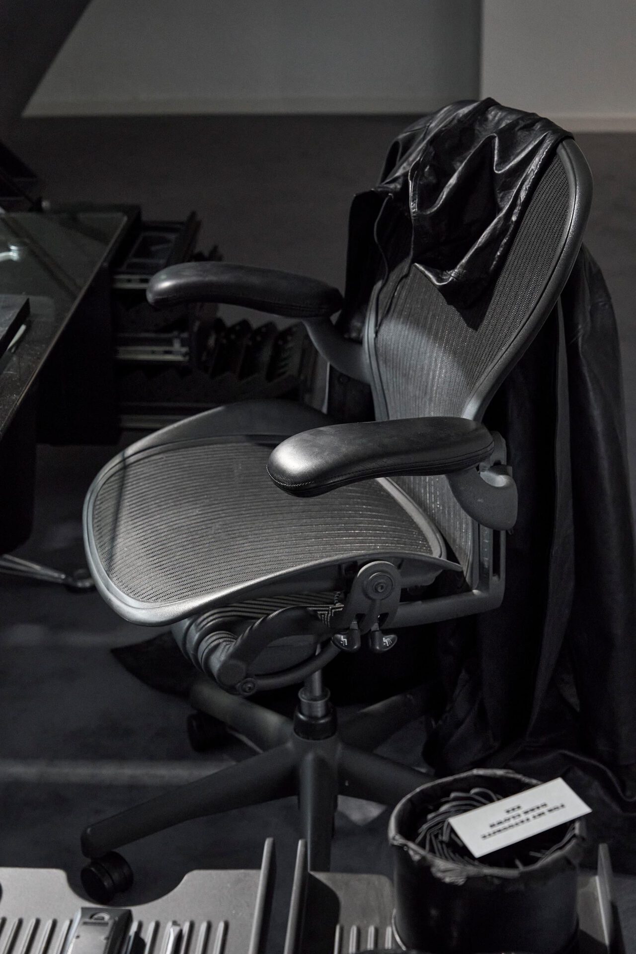 Julian-Jakob Kneer, LAUGHTER HOUSE, 2022, Aeron chair, Balenciaga leather coat, tie pin, variable dimensions