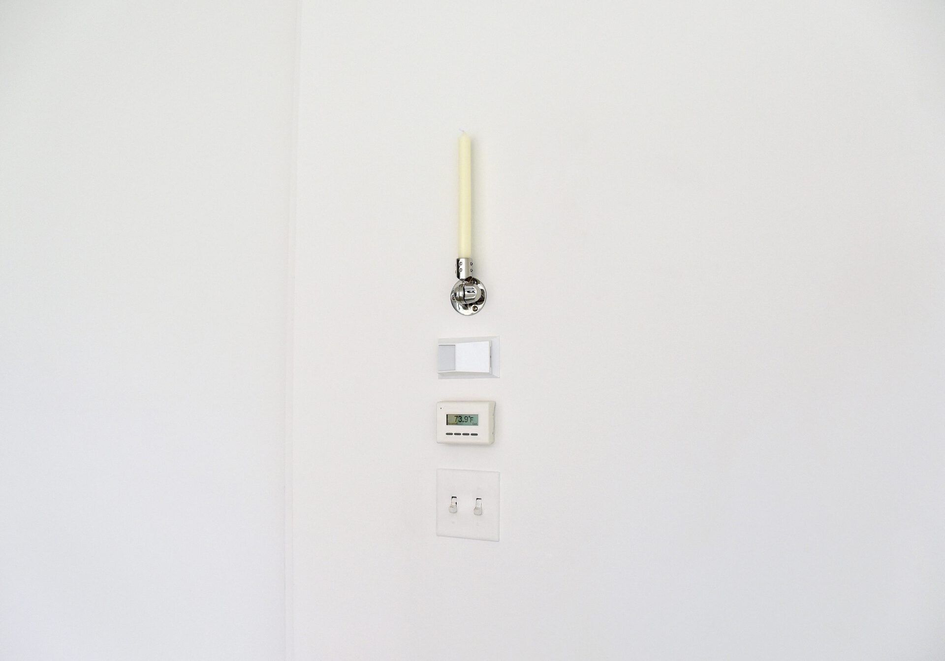 Jerome Sicard, Untitled, 2022, Candle and VHF antenna mount, 3" x 3" x 14".