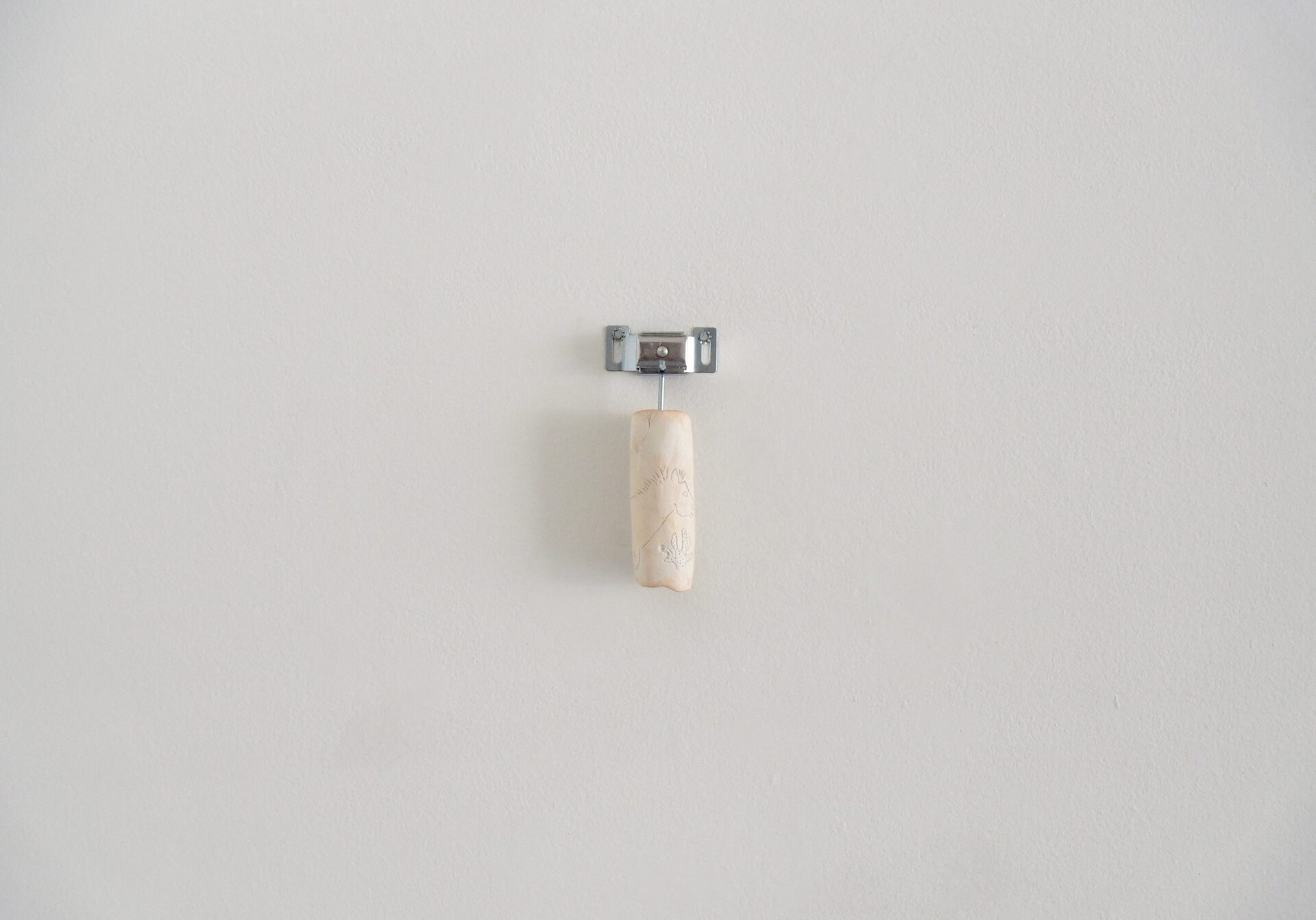 Brea Campbell-Stewart, Untitled ii, 2021, Clay and hardware, 1.5” x 6” x 1.5”.