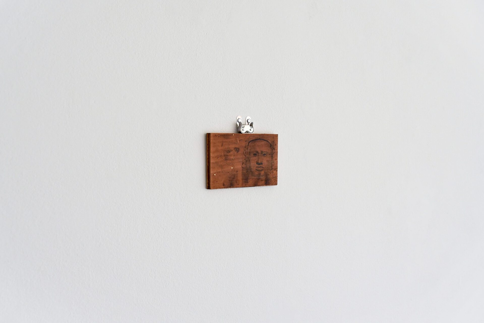 Jerome Sicard, Untitled (installation view), 2022, Ink on carved wood, hardware. 5.5” x 4.5”.