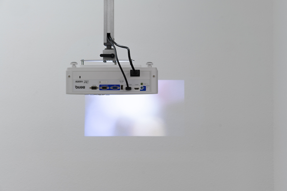 Milena Langer, Movies (Seeker), 2022, Video, projector, ceiling mount, media player, cables