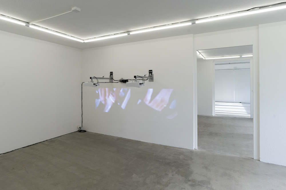 Milena Langer, Movies (Controller), 2022, 2 videos, 2 projectors, 2 wall mounts, 2 media players, cables
