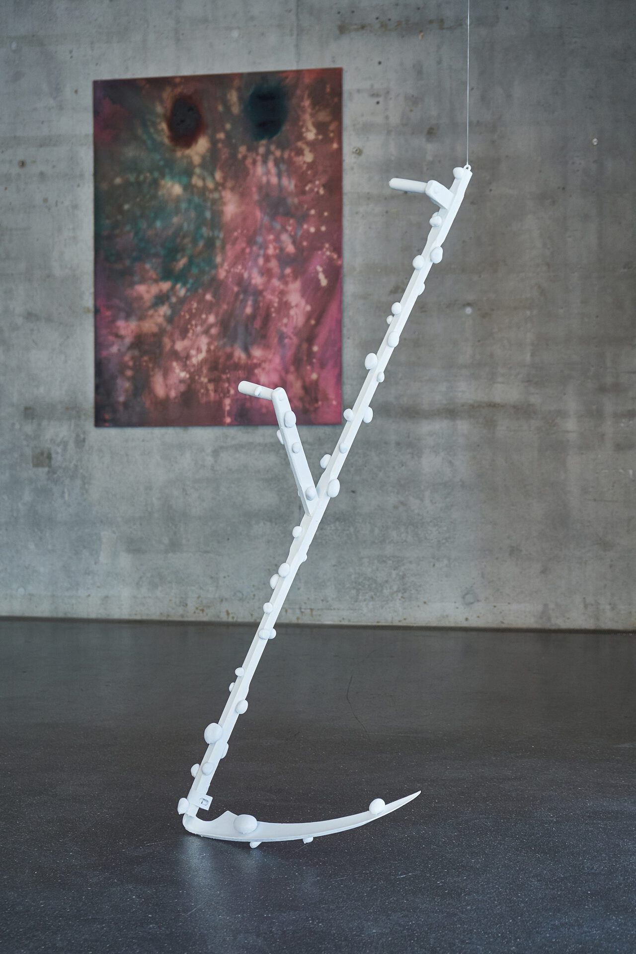 Vincent Scheers, Spirit II.  Scythe, rocks, glue, enamel paint, 170x80x20cm (2022)
