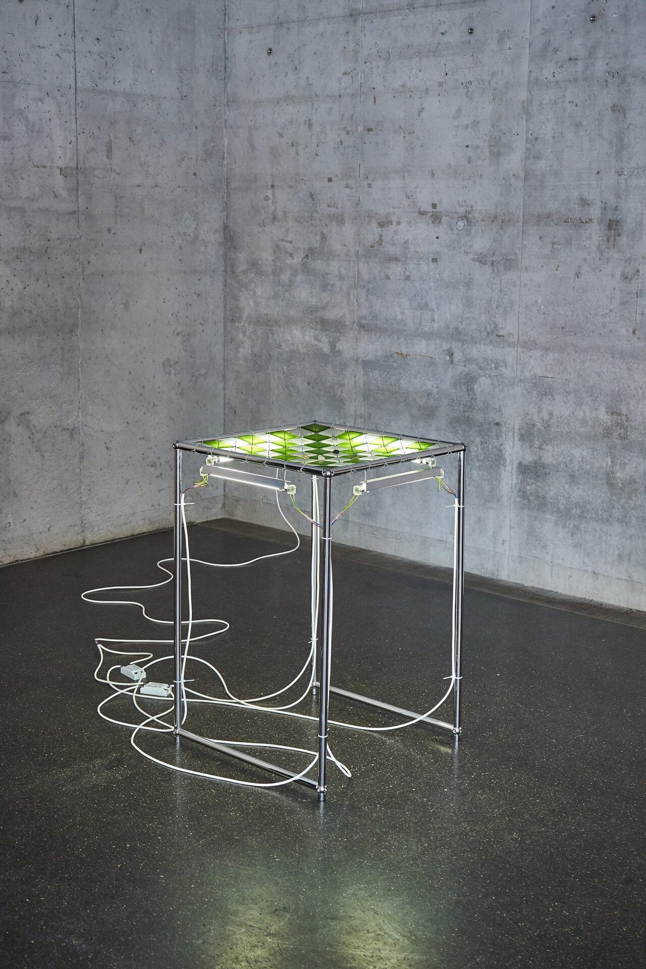 Ju Young Kim, Shape of empty triangle, Fool square. Steel table, Glass tiles, Fluorescent lamp, Electric supply,50x50x70cm (2022)