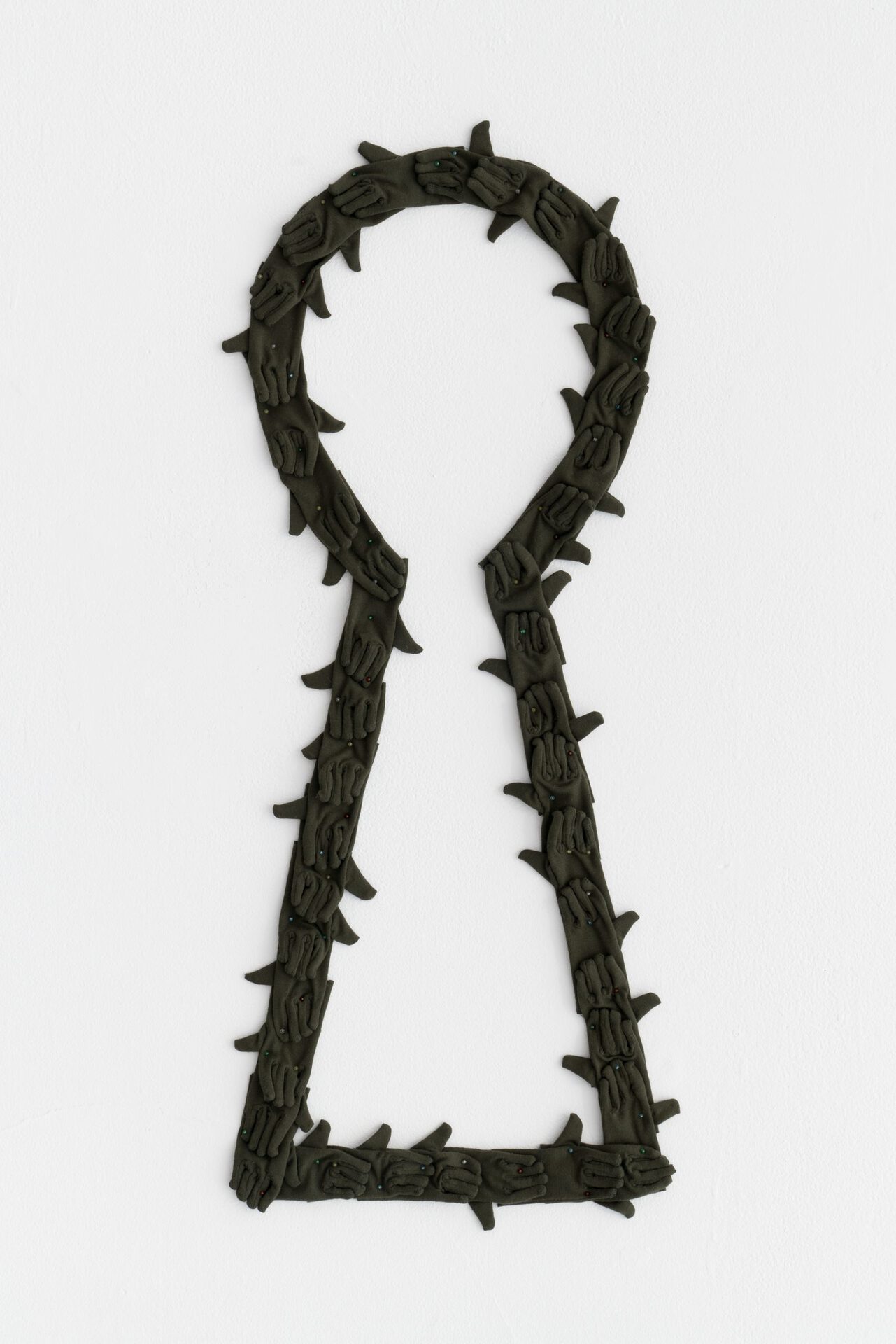 Kyle Alden Martens, 40 Miniature Gloves That Form a Keyhole, 2022, cotton, thread, glass pins, variable dimensions