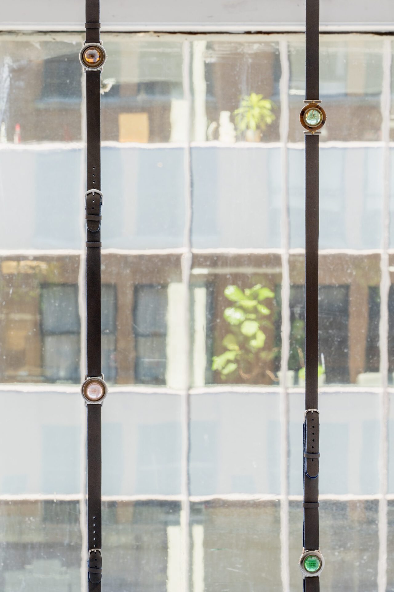 Kyle Alden Martens, Watch Chains with Marbles, 2022, leather, watch faces, buckles, marbles, variable dimensions