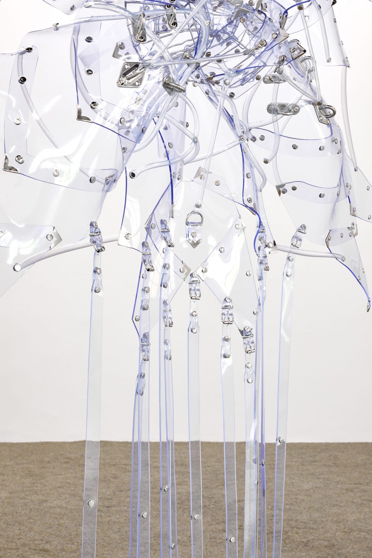 Floryan Varennes, Matriarche, 2022, detail muzzles, medical tubes, medical PVC, stainless-steel fasteners, rivets, rings, medical instruments 160 x 160 cm