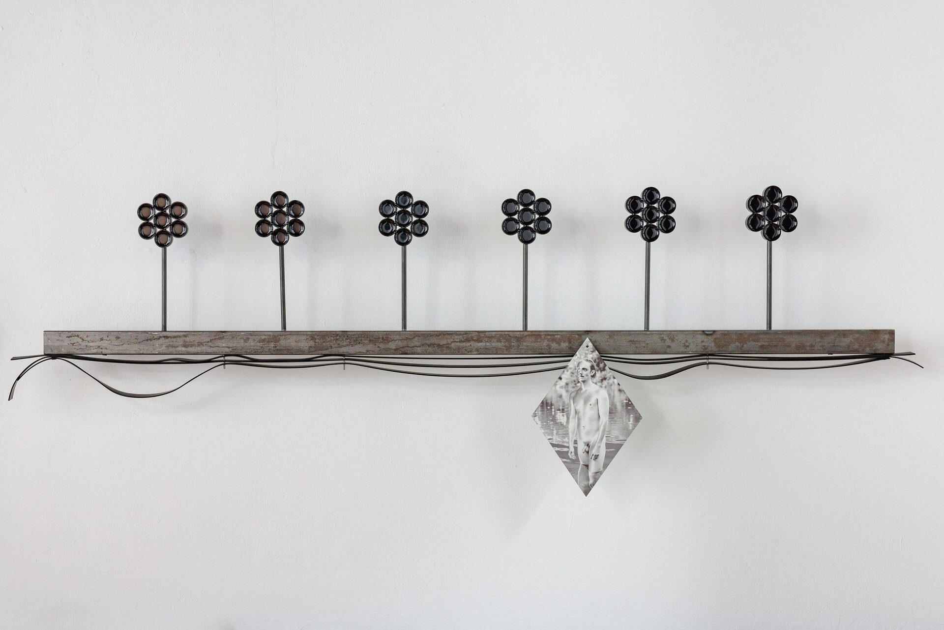 Sasha Auerbakh, Sebastian D. 1, 2022. Steel, UV-print on stainless steel, Kiwopur, pigmented epoxy resin, rubber, 150cm x 30cm x 10cm