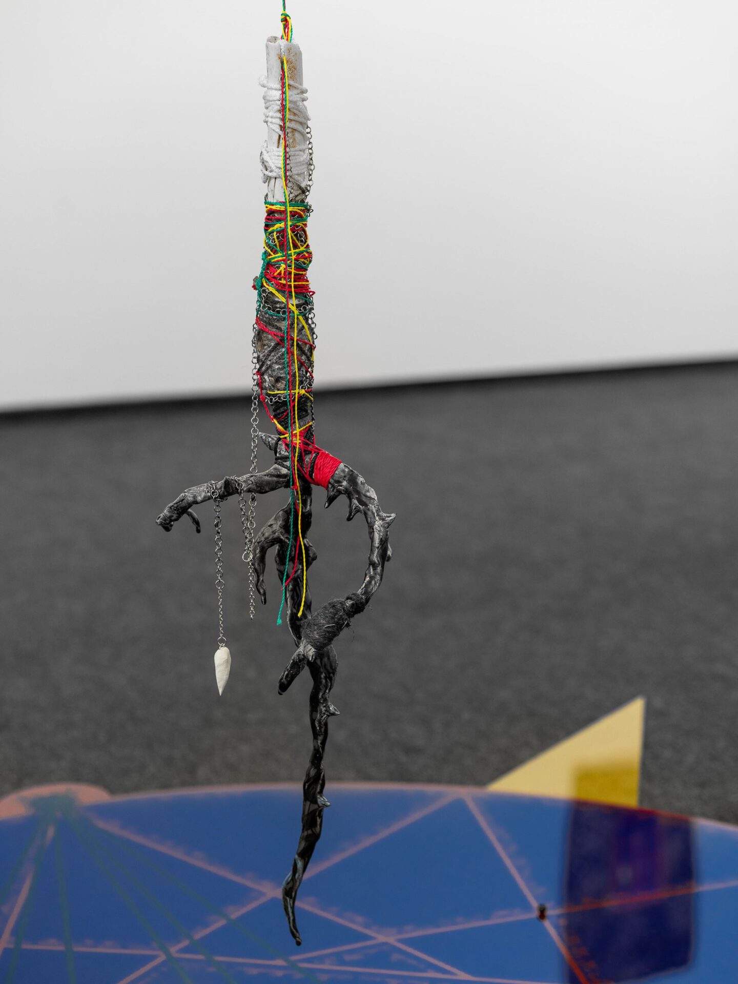 Pavel Polshchikov Decagram // sacral mapping 2022, plexiglass, steel chains, polymer clay, glass, epoxy resin, ropes, bones, jasper, obsidian