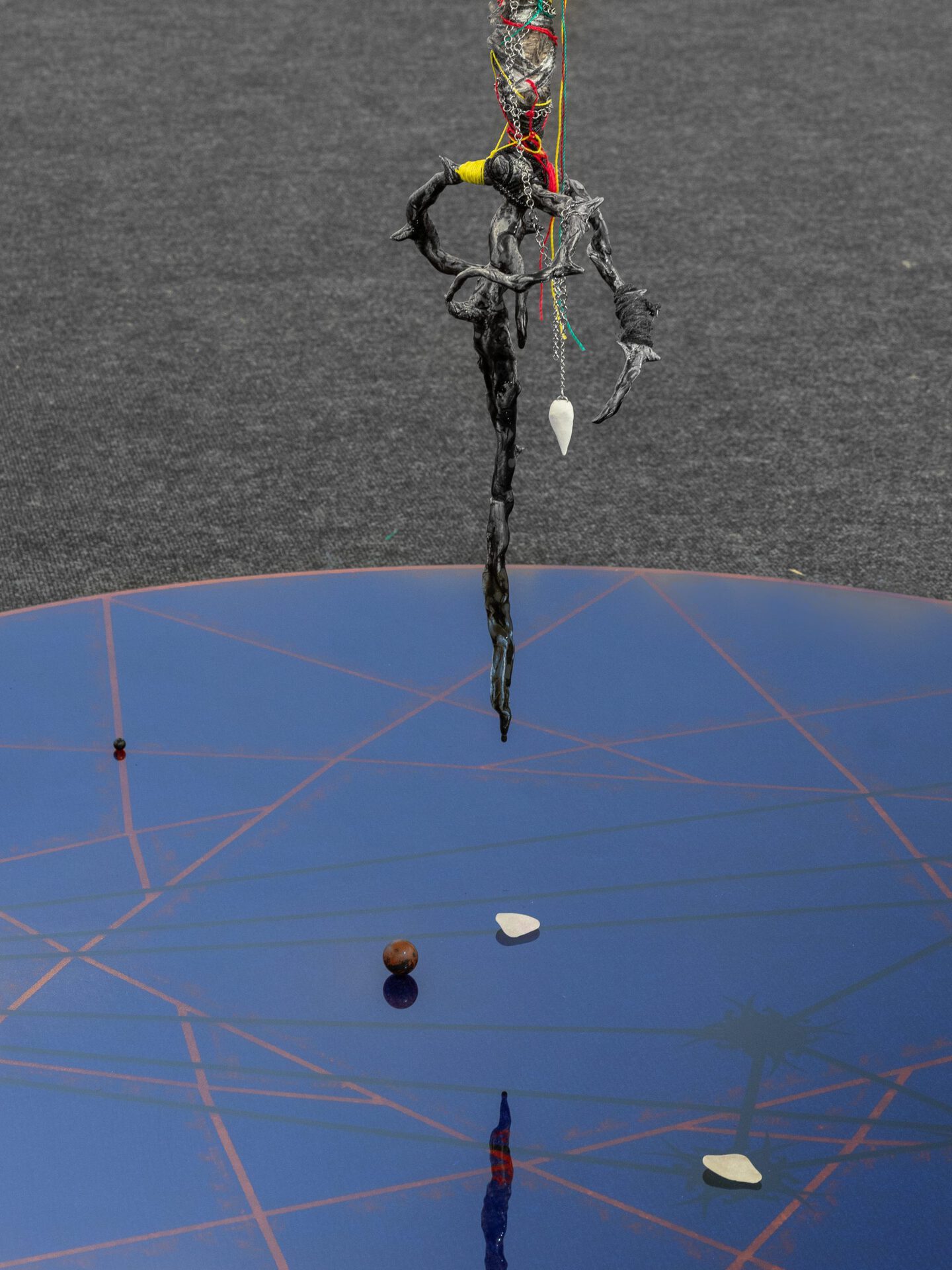 Pavel Polshchikov Decagram // sacral mapping 2022, plexiglass, steel chains, polymer clay, glass, epoxy resin, ropes, bones, jasper, obsidian