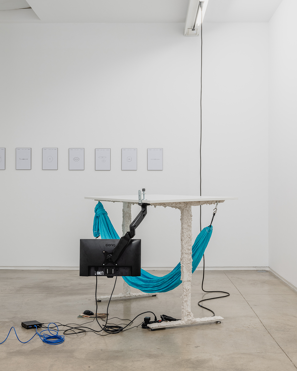 Mario Santamaria, Underdesk, 2022, desk with a fireproof mortar, a metallic arm, a screen and a hammock, variable dimensions