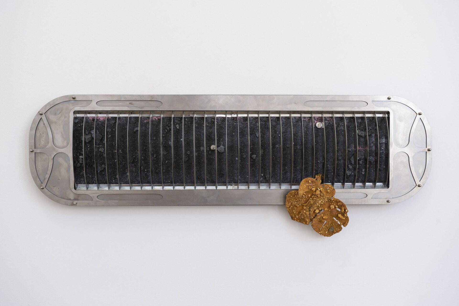 Šimon Chovan, Chiral filter (right channel), 2022, Black steel, steel dust, soil, silicone, Courtesy of the artist