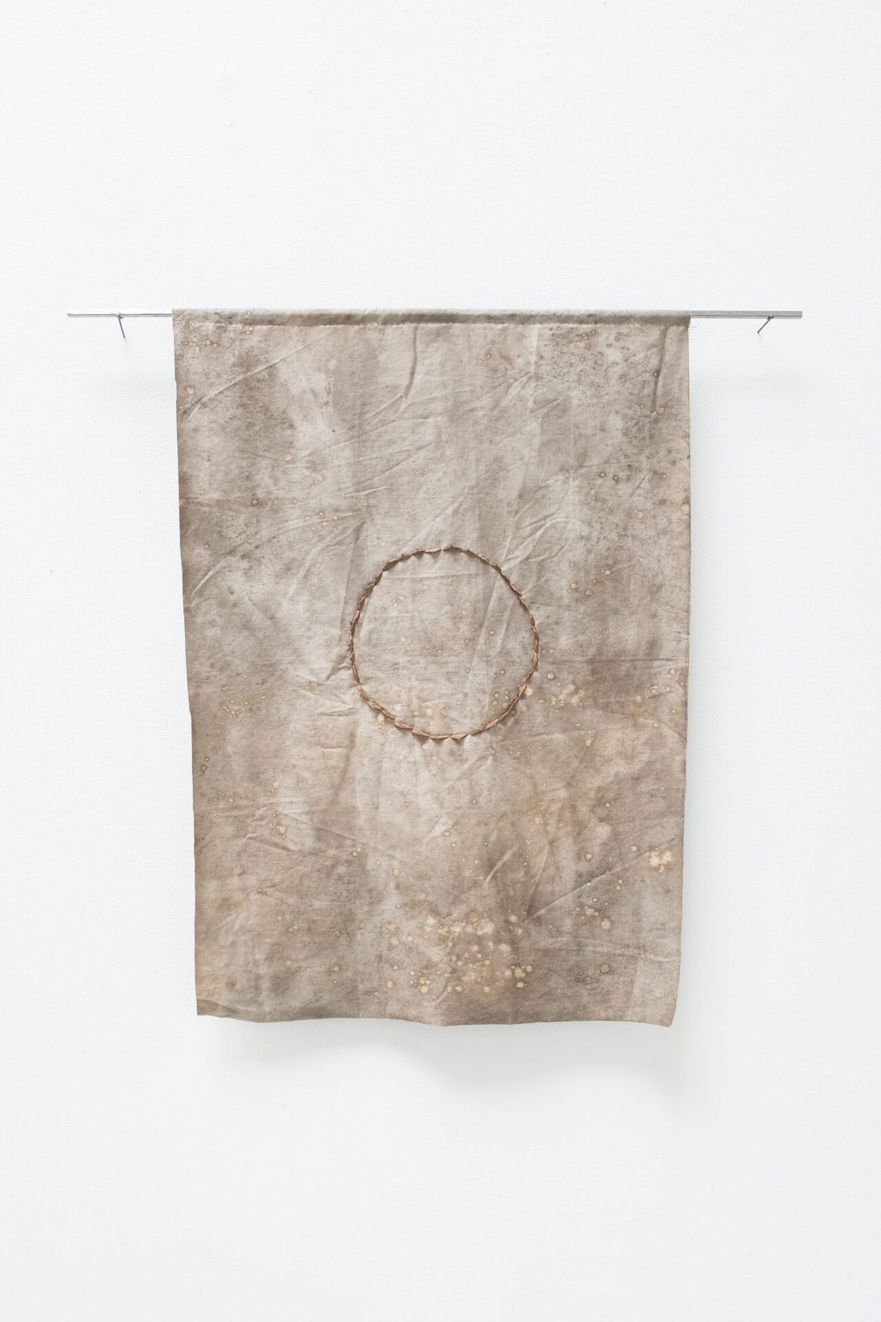 Katharina Gahlert,Angry Circle, 2022, Textile dyed with catechu and Rust, Rose Thorns, Yarn, 67 x 47 cm