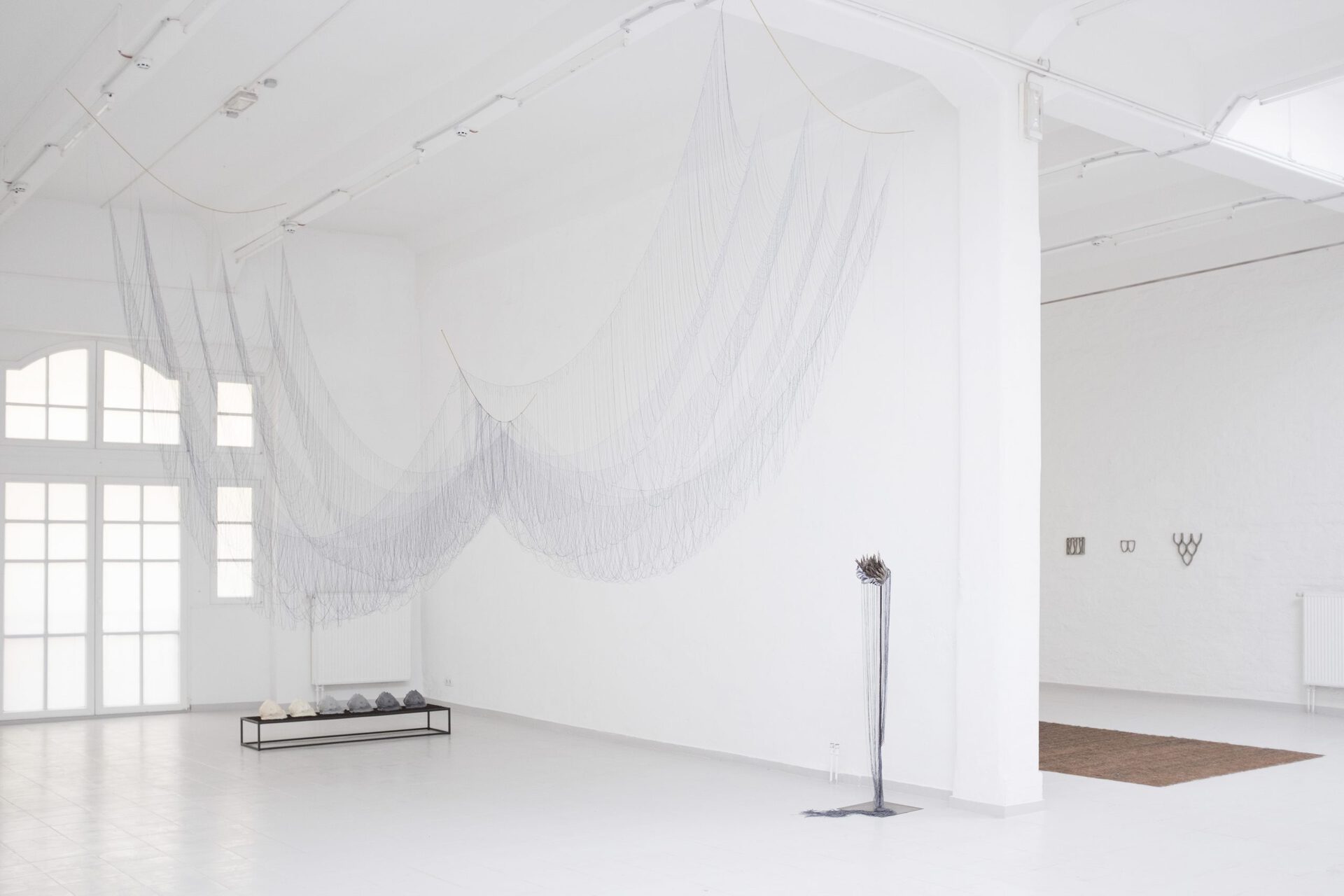 Exhibition View, Mirsini Artakianou, Untitled, Thread, Brass, Textile 10meter Long x 300cm, Katharina Gahlert, Crown of Creation (In you I see me), various fabrics, steel, 30x18x15cm + 2m