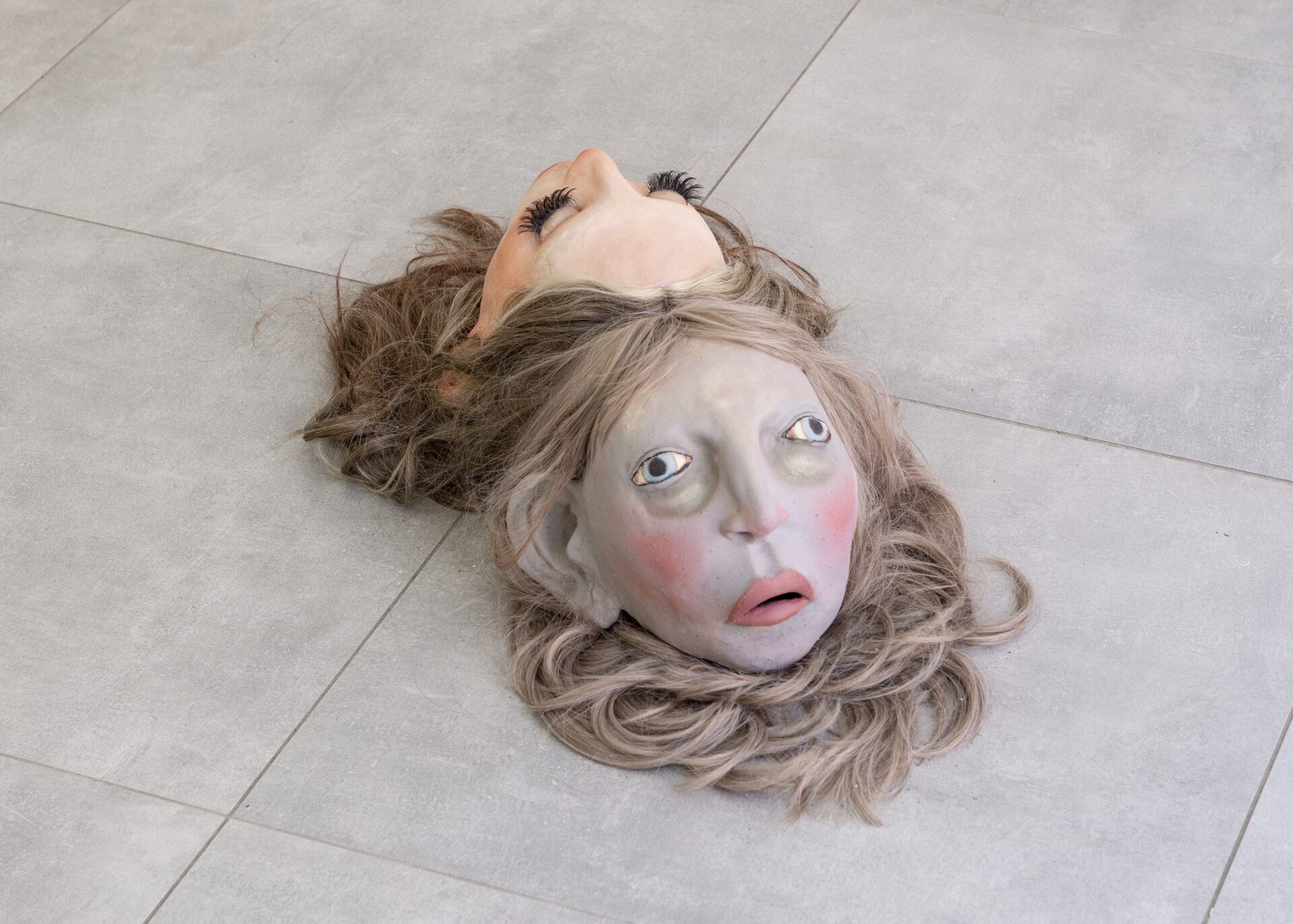 Clément Garcia-Le Gouez, Guest atone fatiguée, 2022 and Guest tiktokeuz endormie, 2021, glazed stoneware, wig, lipgloss and coloured stoneware, make-up and false eyelashes