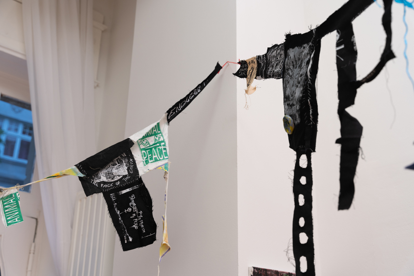 Jake Kent, Clown Ephemera pt. 2, Screen printed patches, hair, ceramic, and found materials, Detail view2, 2021-ongoing