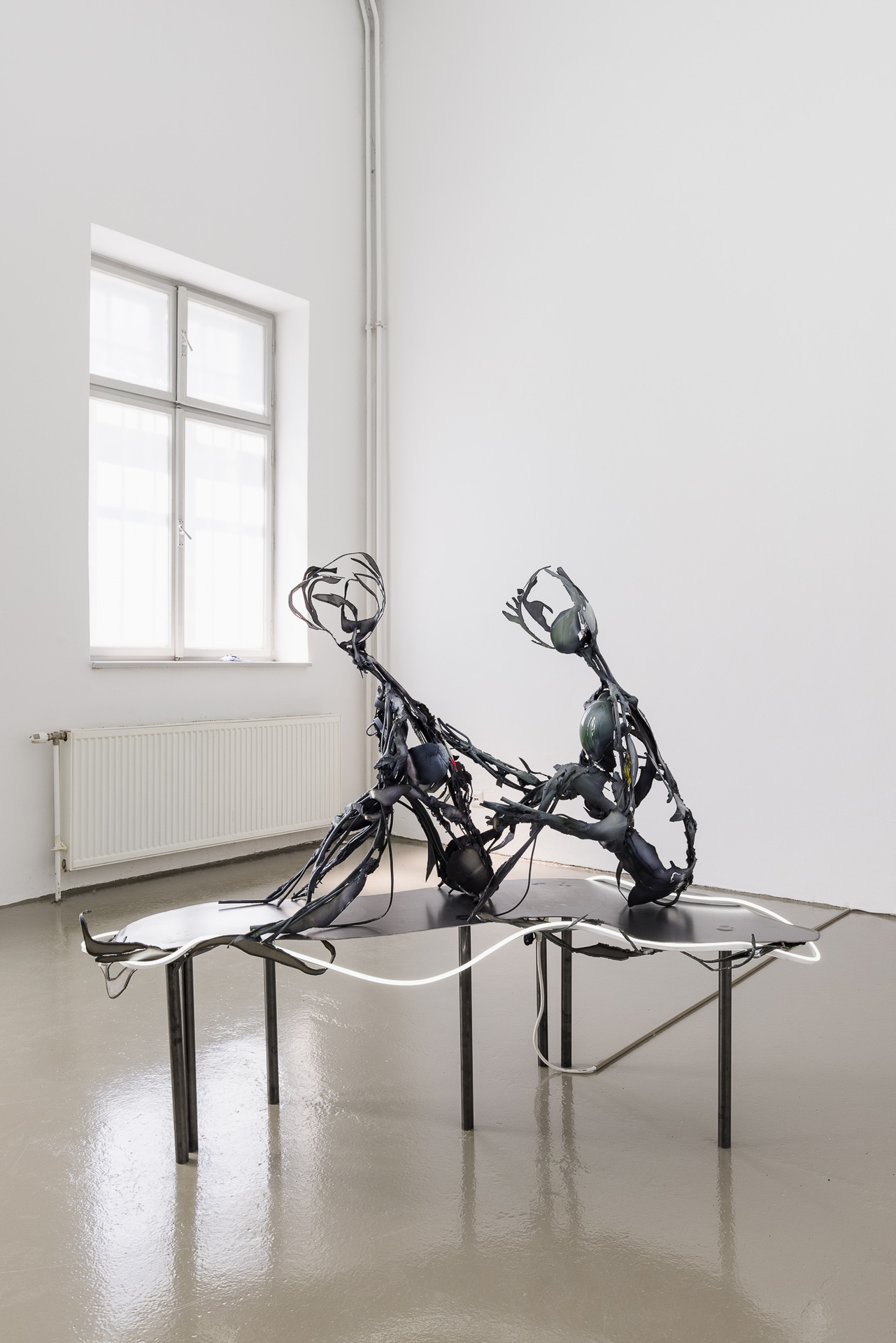Proper amount of Pathos, Caring, and Necessity of other beings. A cat can't groom her forehead. Electrical wire, Epoxy putty, Found objects, Steel, Acrylic ink, LED strips 170 x 50 x 134 cm, 2022