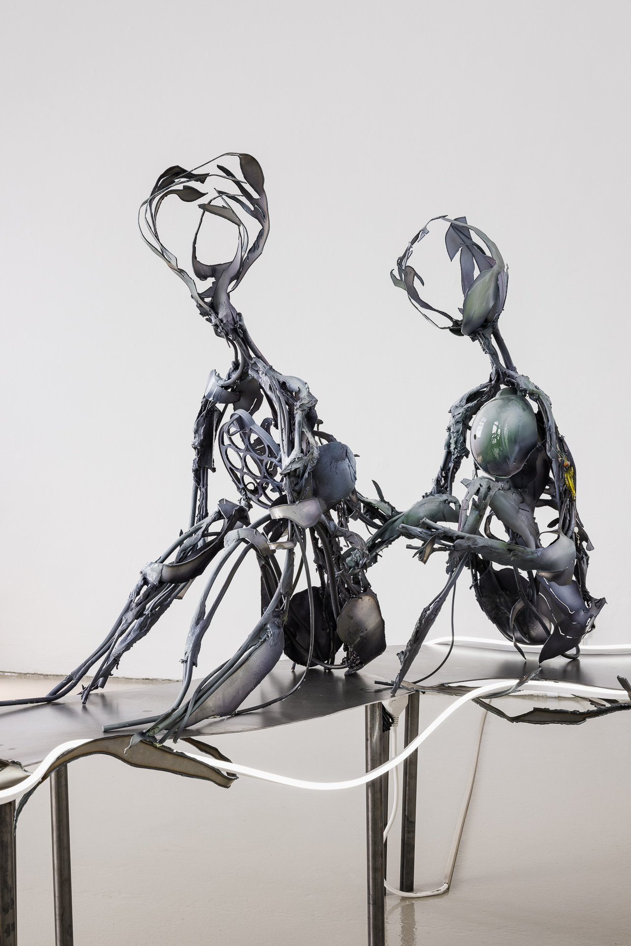 Proper amount of Pathos, Caring, and Necessity of other beings. A cat can't groom her forehead. Electrical wire, Epoxy putty, Found objects, Steel, Acrylic ink, LED strips 170 x 50 x 134 cm, 2022