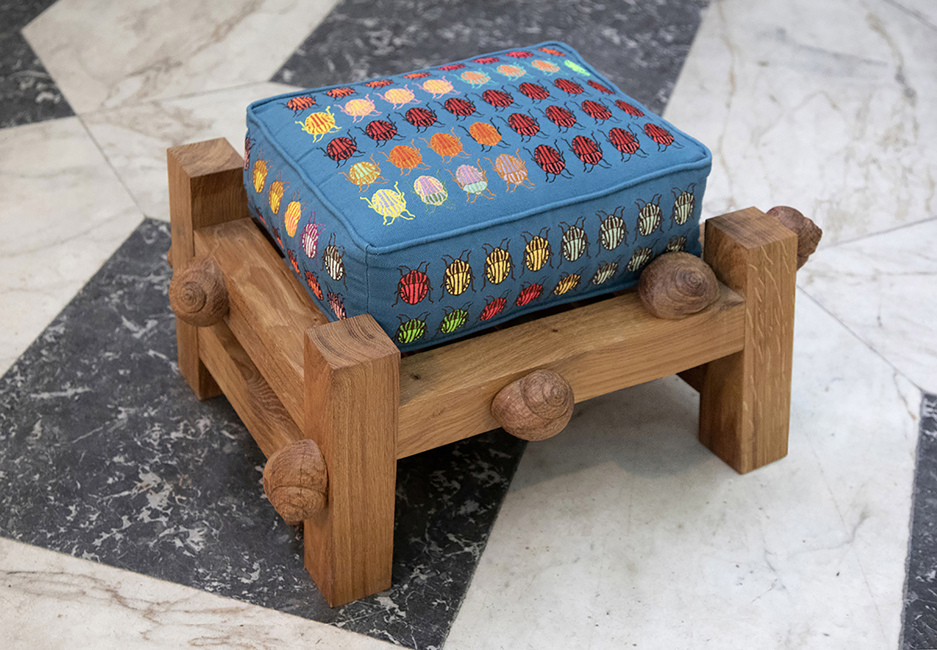 Daniel Dewar &amp; Grégory Gicquel, Oak bench with striped shield bugs and snails, 2021, oak wood and embroidery on cushion, 41 x 66 x 56 cm