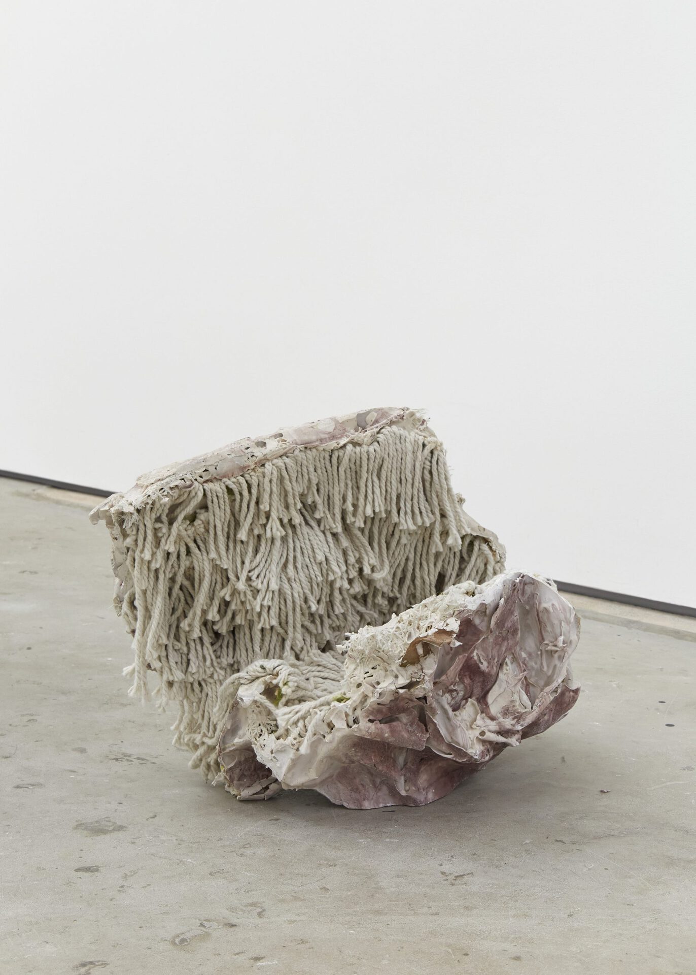 Aidan Duffy, Slouched Husk, 2021. Jesmonite, ochre and mop yarn, 39 (H) x 60 (W) x 35 (D) cm