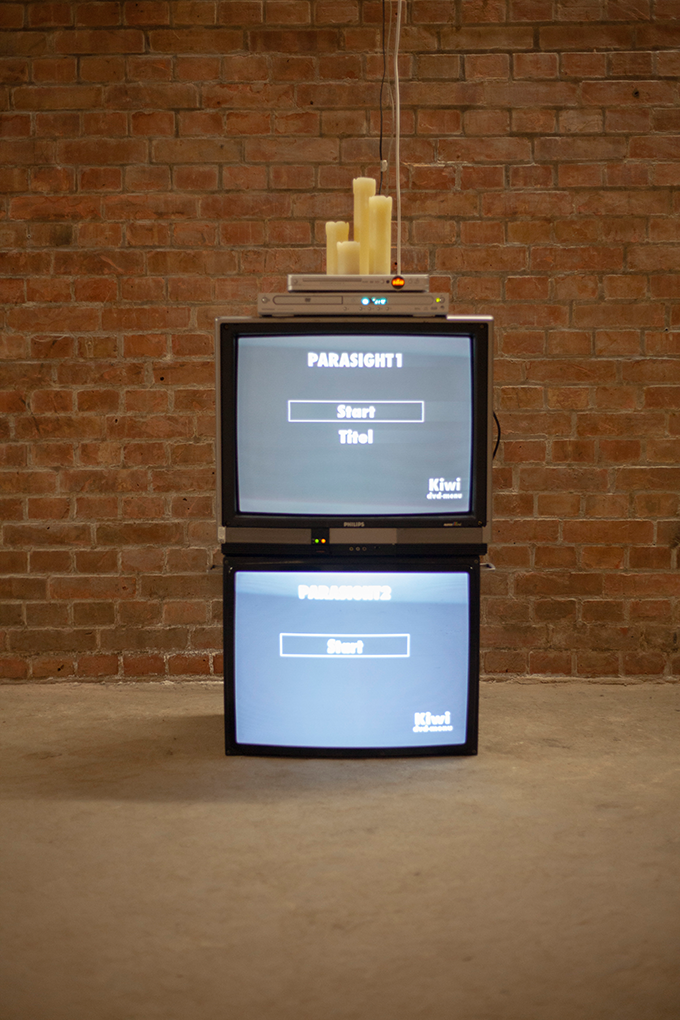 installation view, screens, receivers, led-candles