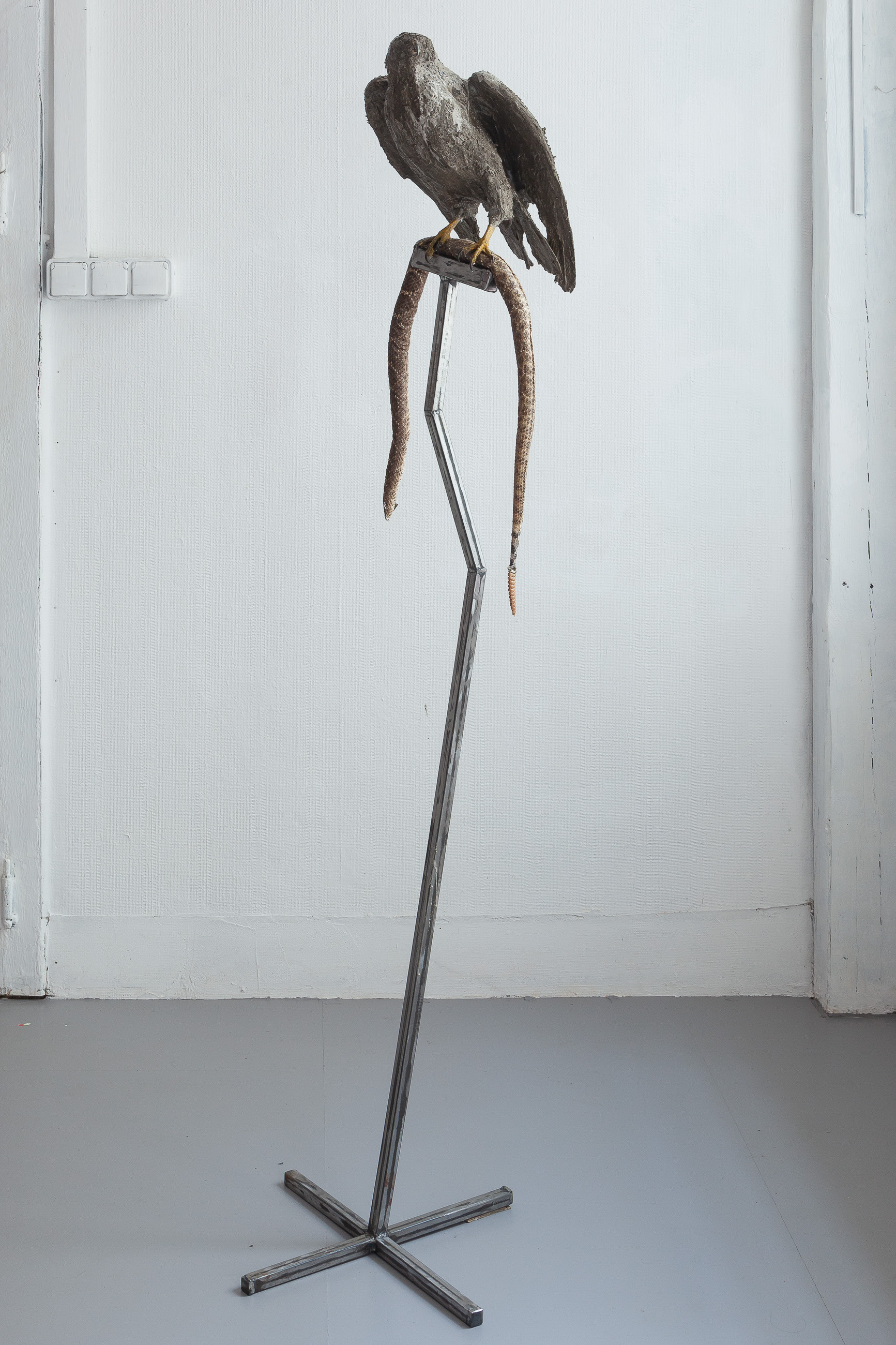 10 Nicolás Astorga, REVENGE & REDEMPTION, upcycled reassembled rattlesnake skin, upcycled falcon taxidermy, steel, 180 x 40 x 40 cm, 2022
