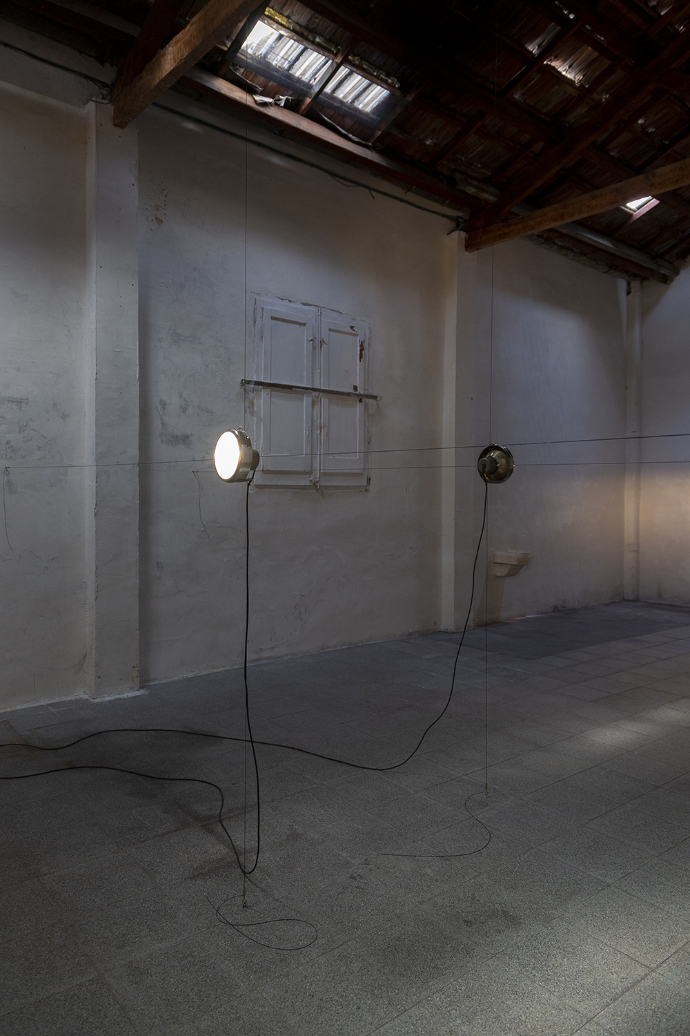 Ian Waelder. From time to time, 2022. Two switched on original Opel Olympia headlights (1935 model), wiring system and turnbuckles. Variable dimensions.